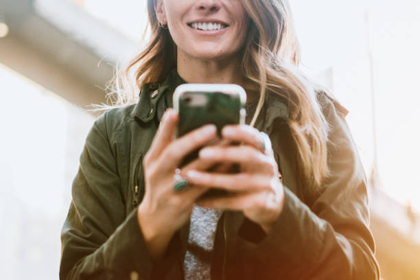 istock Woman Uses Smart Phone To Get Directions in Seattle 954334576