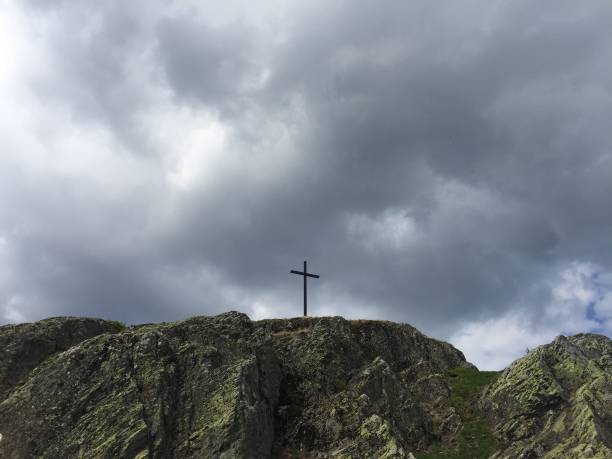 istock Metal Cross on top of a mountain 954335476