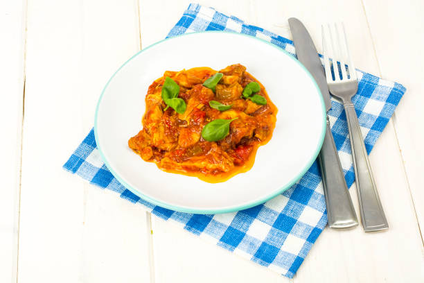 istock Fillet meat chicken, turkey with paprika and tomatoes 954338022
