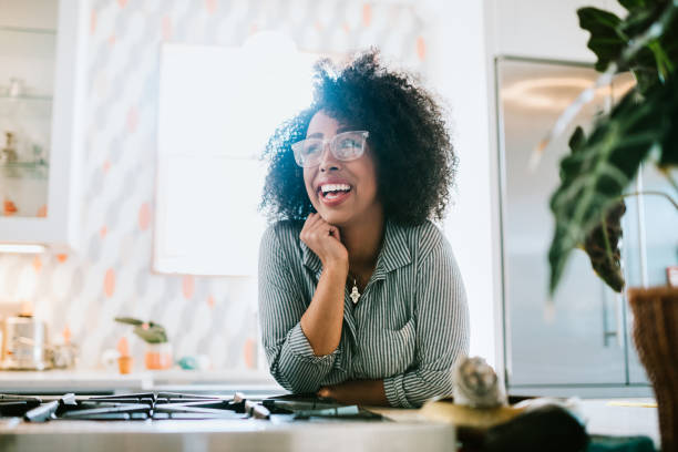 istock A Young Woman Relaxes in Her Modern Home Kitchen 954339414