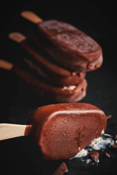 istock Vanilla Ice Cream with Chocolate on a Stick 954339838