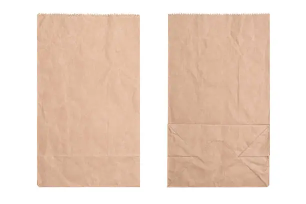 New kraft paper bag laying flat front and back isolated white background and clipping path.