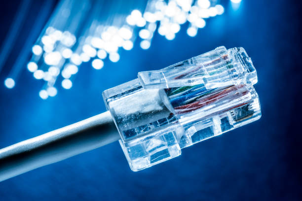 istock Network cable and optical fibers with lights. 954340704