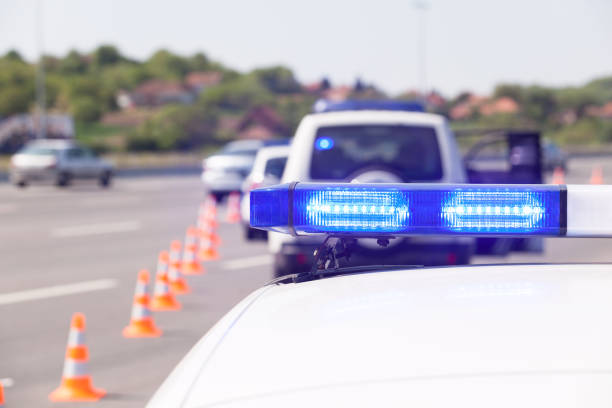istock Police car emergency lighting during highway traffic control 954343840