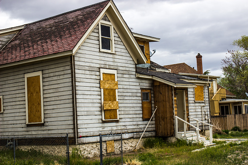 Abandoned Home With Boarded Up Windows