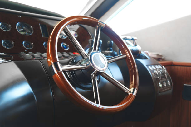 istock steering wheel on a luxury yacht. 954353180