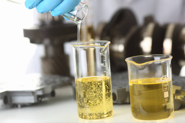 istock Male hands in protective gloves hold test tube 954353812