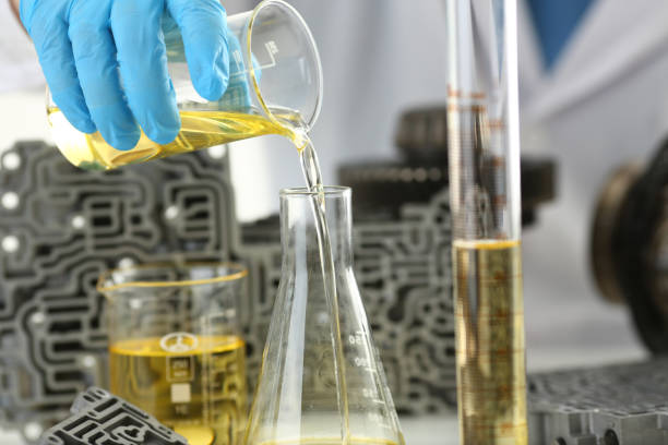 istock Male hands in protective gloves hold test tube 954353828