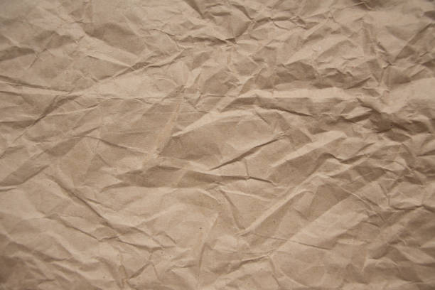 istock Brown rough crumpled recycled paper texture 954354062