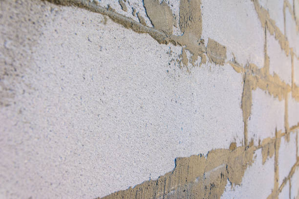 istock Gray wall of foam blocks on glutinous solution 954361800