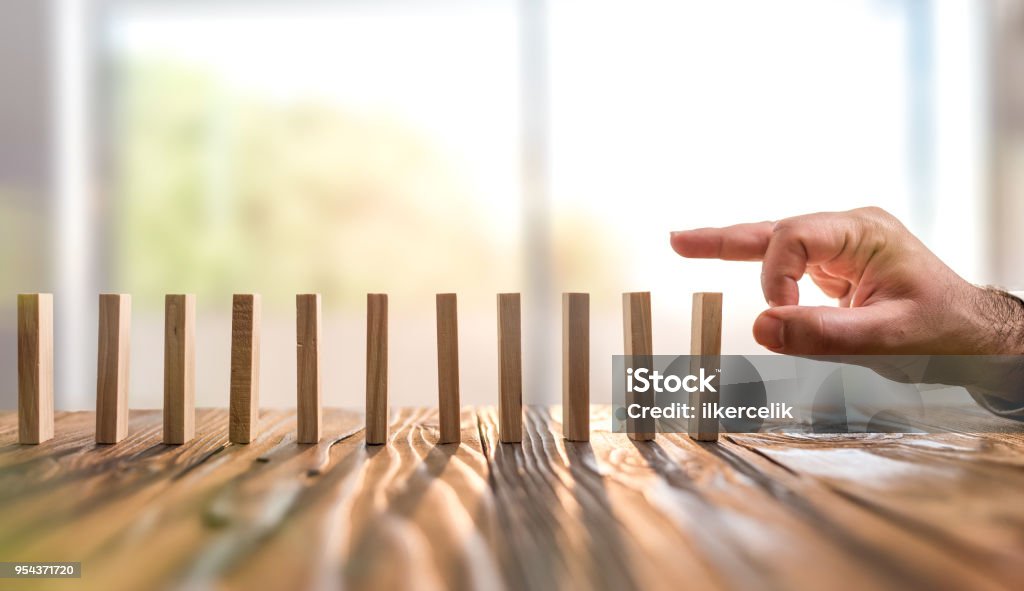 Domino Effect. Just Starting or Triggering Multi Effective Business Process Domino Stock Photo