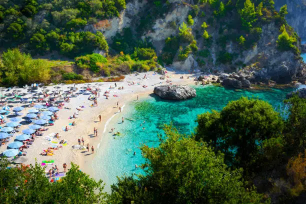 Beautiful landscape of Parga, panoramic view of the Piso Krioneri beach with turquoise sea and lots of green around, taken from the hill.