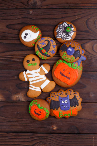 istock Delicious homemade Halloween ginger cookies with ghosts, pumpkin 954384500
