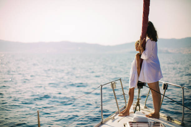 istock Mother and daughter enjoying on yacht 954384988