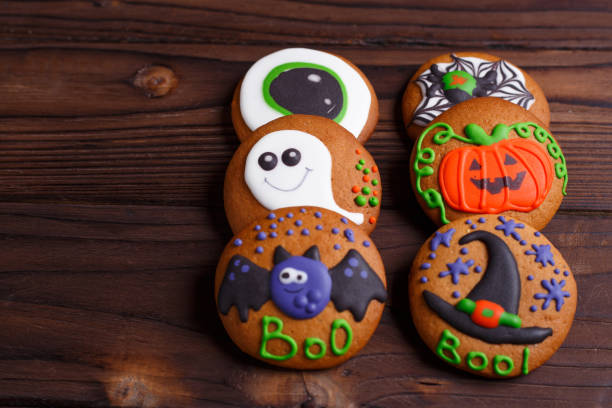 istock Halloween ginger biscuits set with funny decorations made of con 954386272