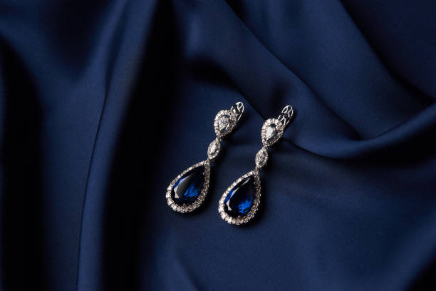 istock Two Golden sapphire earrings with small diamonds 954389620