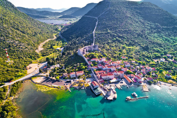 Mali Ston waterfront aerial view, Ston walls in Dalmatia region of Croatia Mali Ston waterfront aerial view, Ston walls in Dalmatia region of Croatia dubrovnik walls stock pictures, royalty-free photos & images