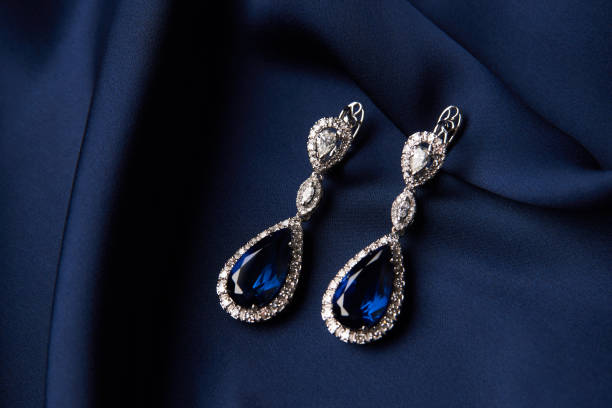 istock Two Golden sapphire earrings with small diamonds 954390776