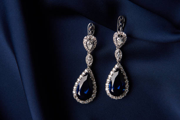 istock Two Golden sapphire earrings with small diamonds 954391162
