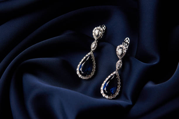 istock Two Golden sapphire earrings with small diamonds 954391364