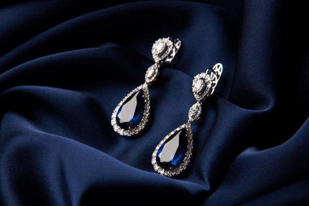istock Two Golden sapphire earrings with small diamonds 954391528