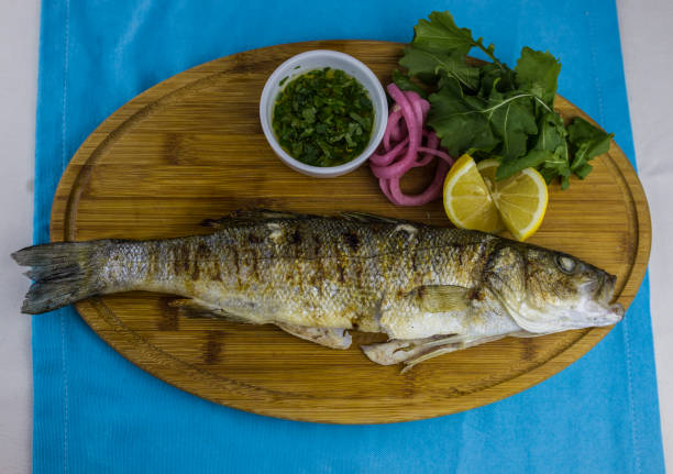 istock Roasted sea bream fish with lemon slices 954391626
