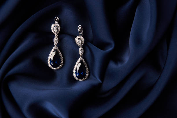istock Two Golden sapphire earrings with small diamonds 954391764
