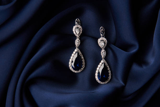 istock Two Golden sapphire earrings with small diamonds 954392028
