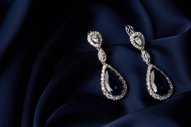 istock Two Golden sapphire earrings with small diamonds 954392228