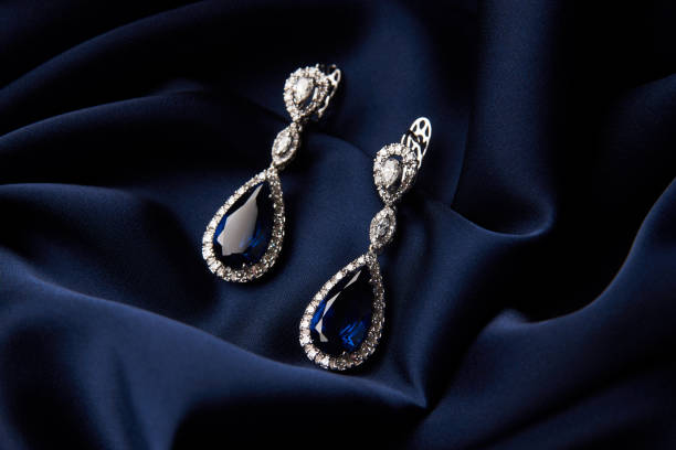 istock Two Golden sapphire earrings with small diamonds 954392444