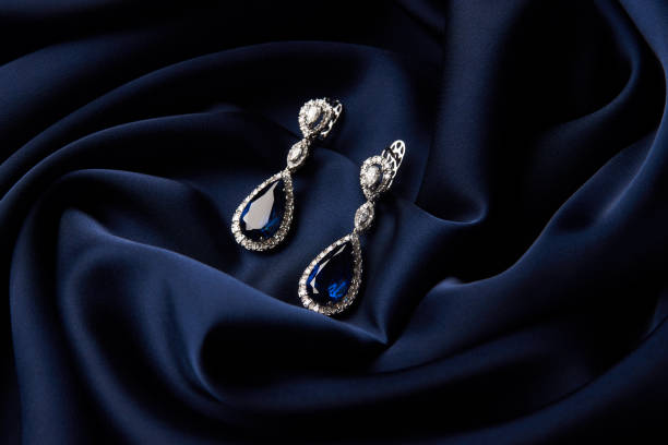 istock Two Golden sapphire earrings with small diamonds 954392692