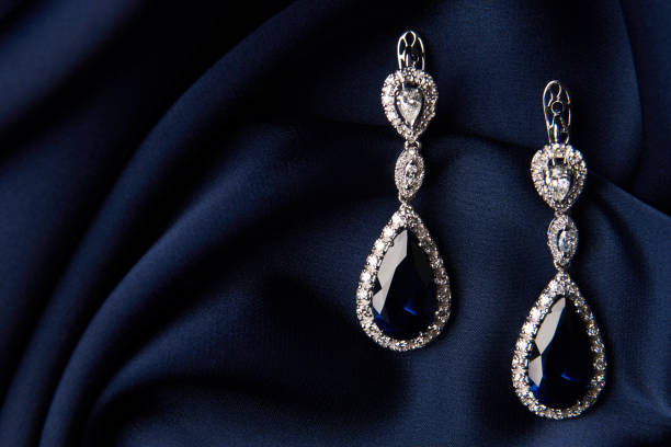 istock Two Golden sapphire earrings with small diamonds 954396746