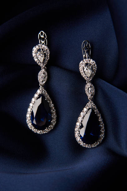 istock Two Golden sapphire earrings with small diamonds 954397408