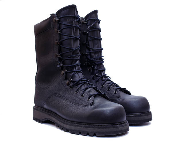 istock Pair of black military style leather boots, isolated 954400178