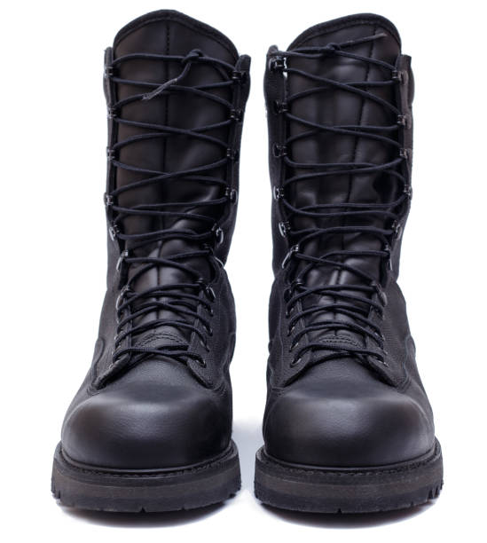 Pair of black military style leather boots, isolated, front view
