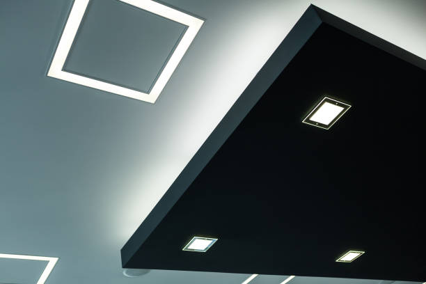 istock Geometric construction of celling maden with drywall and using modern economical LED light. 954403864