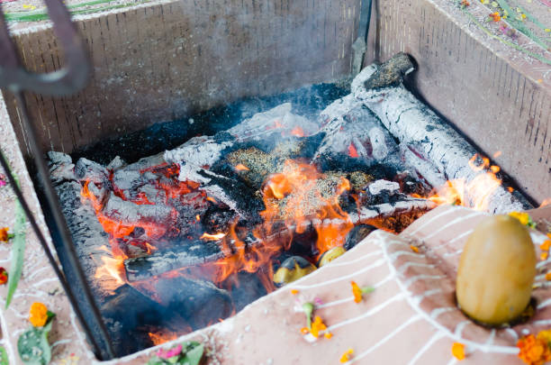 fire ceremony with offers of only vegetable origin during Guru Purnima fire ceremony with offers of only vegetable origin during Guru Purnima lingam yoni stock pictures, royalty-free photos & images