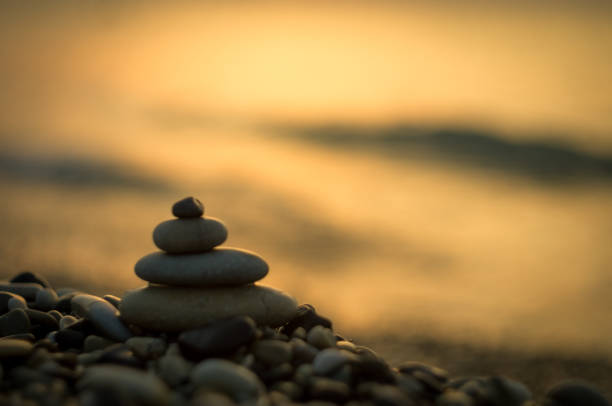 istock stack of zen stones on pebble beach 954418658