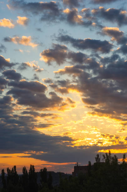 istock Landscape with dramatic light - beautiful golden sunset with saturated sky and clouds. 954422764
