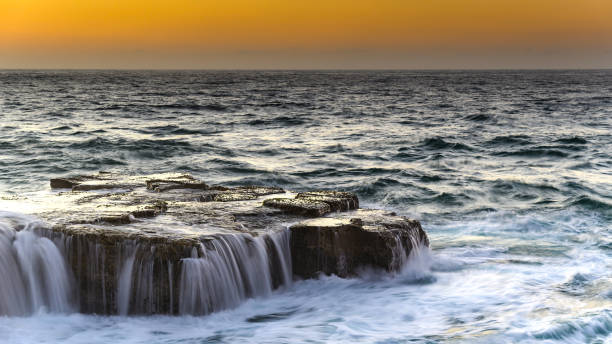 istock Rocky Sunrise Seascape 954423398