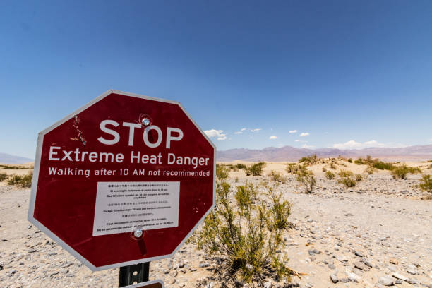 STOP! Extreme Heat Death Valley USA. Advisory sign not so walk too far. Temperatures on that day were around 50C/122F death valley desert photos stock pictures, royalty-free photos & images
