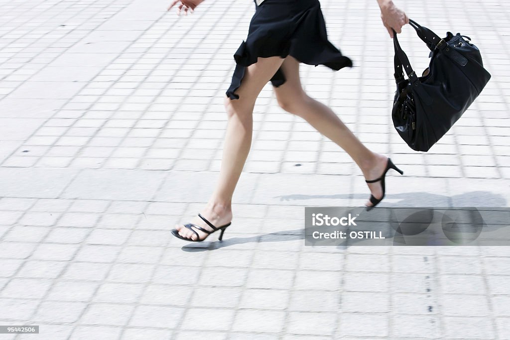 detail caucasian woman legs running in the street  One Woman Only Stock Photo