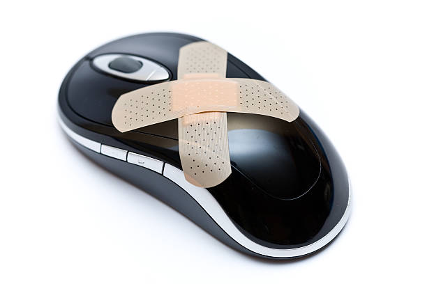 computer mouse & bandage stock photo