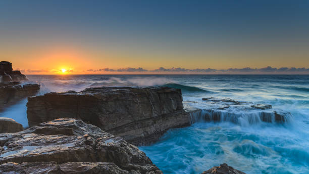 istock Rocky Sunrise Seascape 954426804