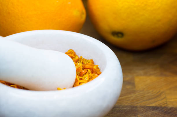 istock White marble mortar with the orange zest 954427346