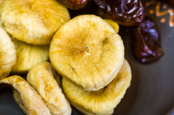istock dried dates and figs in a ceramic plate on a wooden table 954428550