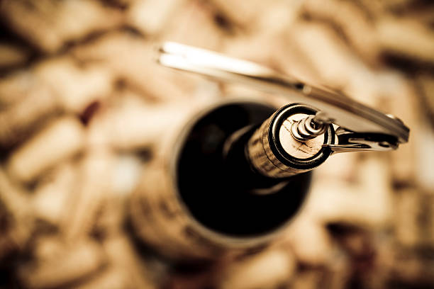 Birdseye view of corkscrew in cork of wine bottle stock photo