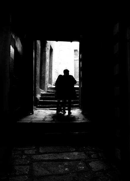 istock Old Man and Daughter in Alley 954433668