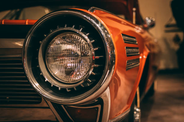 istock A retro 1950's salmon color car front right headlight 954433982