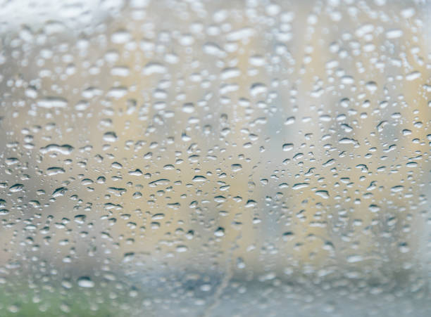 istock raindrops on the glass closeup 954434132